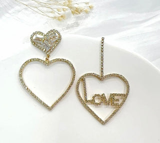 Boucles d’oreilles love/cœur strass asymétriques or